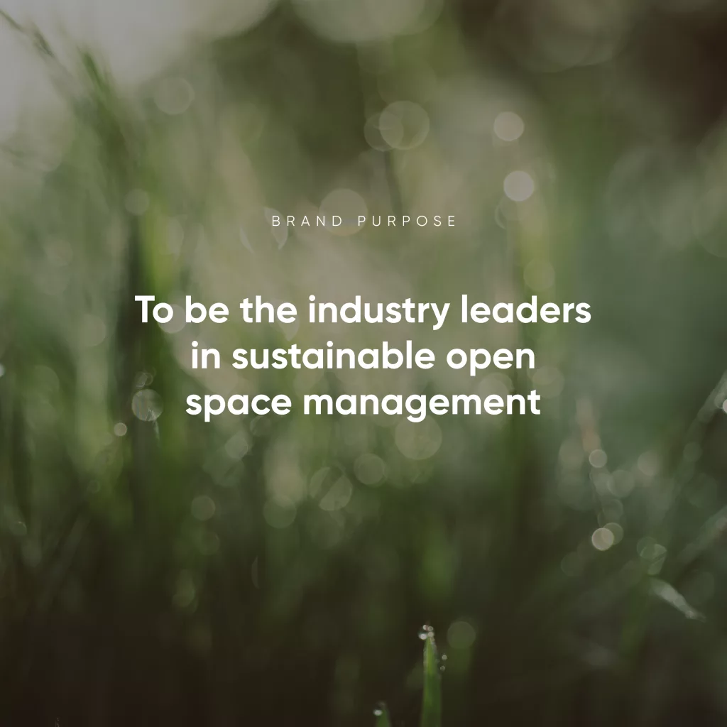 Blurred close-up of grass with bokeh and white text reading To be the industry leaders in sustainable open space management