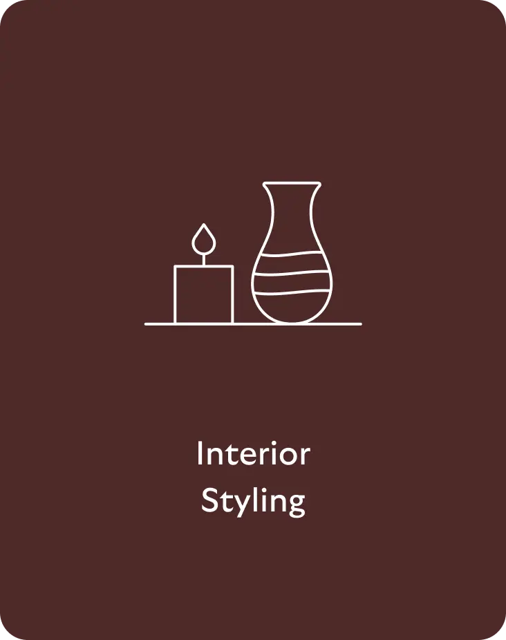 Minimal white line icon of a candle and decorative vase on a shelf with the words Interior Styling on a brown background.