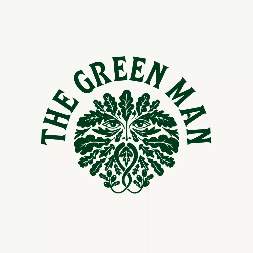 Stylised dark-green Green Man face formed from oak leaves with THE GREEN MAN arched above.