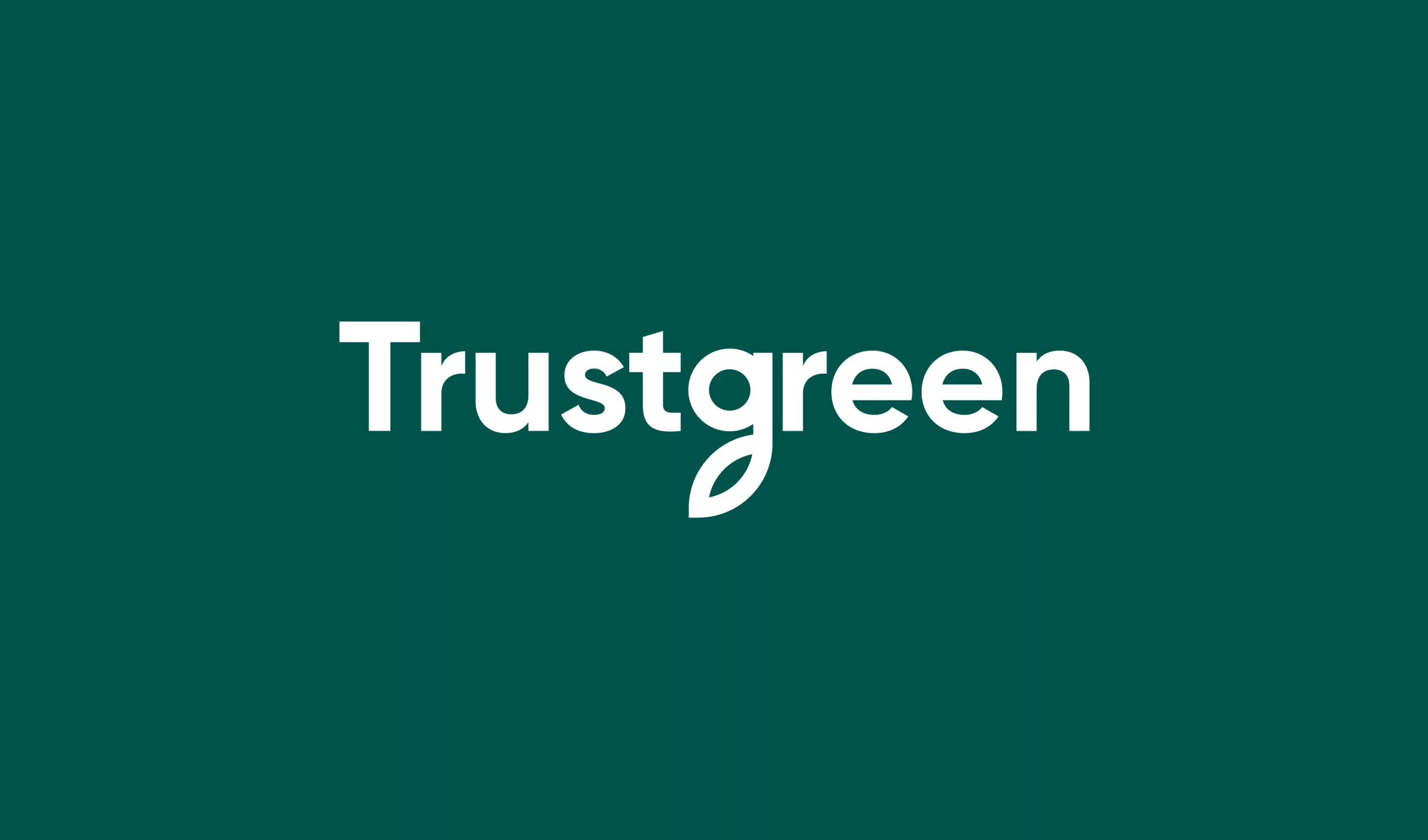 Trustgreen wordmark in white on a dark green background, with a stylised leaf forming the tail of the letter g.